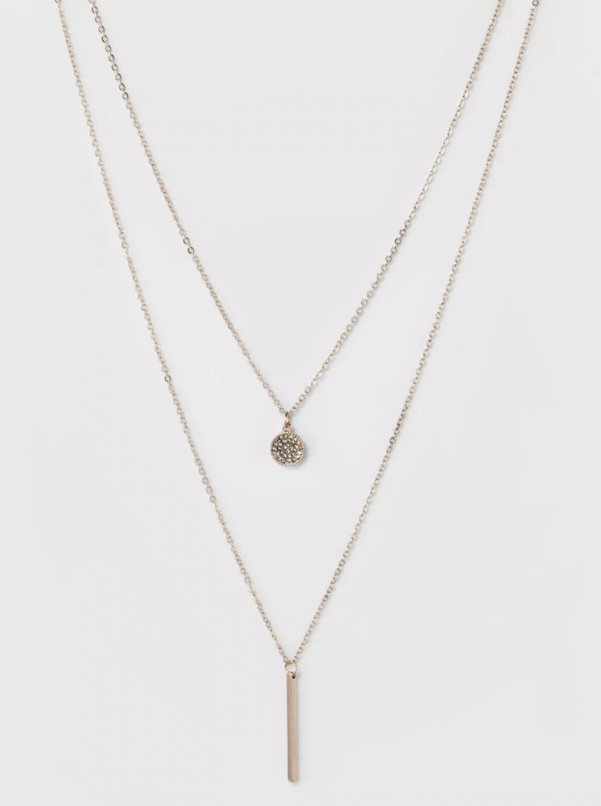 layered rose gold chains with a small pendant and a thin bar
