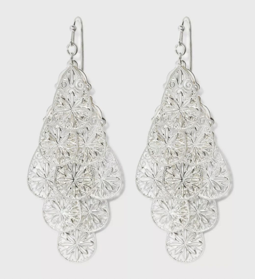 layered earrings in silver with a floral design