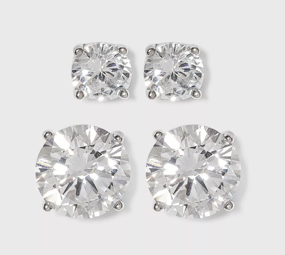 two sets of cubic zirconia earrings with silver hardware