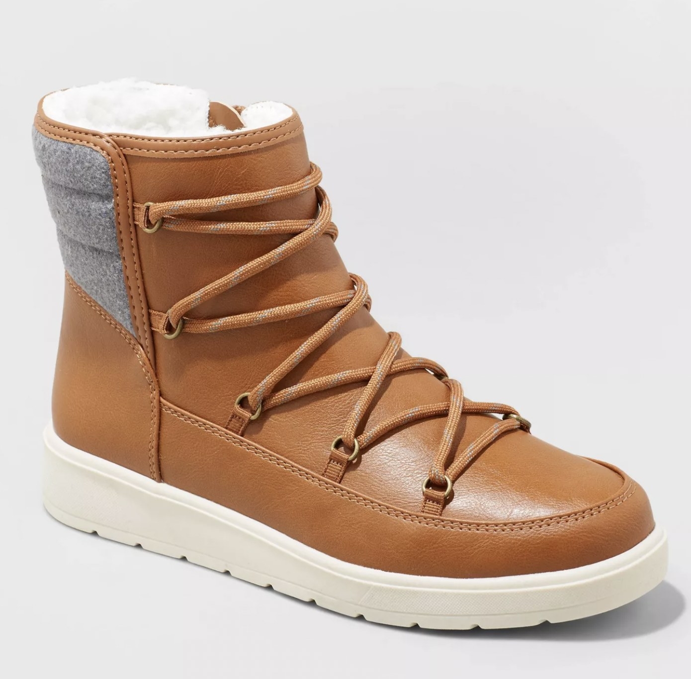 The tan laced boot with white rubber sole
