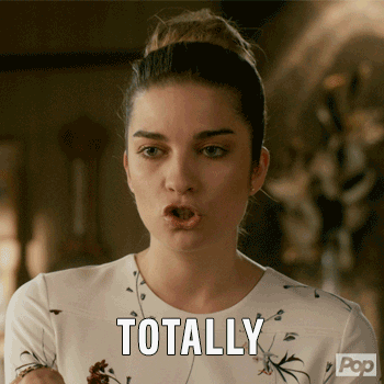 a gif of alexis from schitt&#x27;s creek nodding and saying &quot;totally&quot;