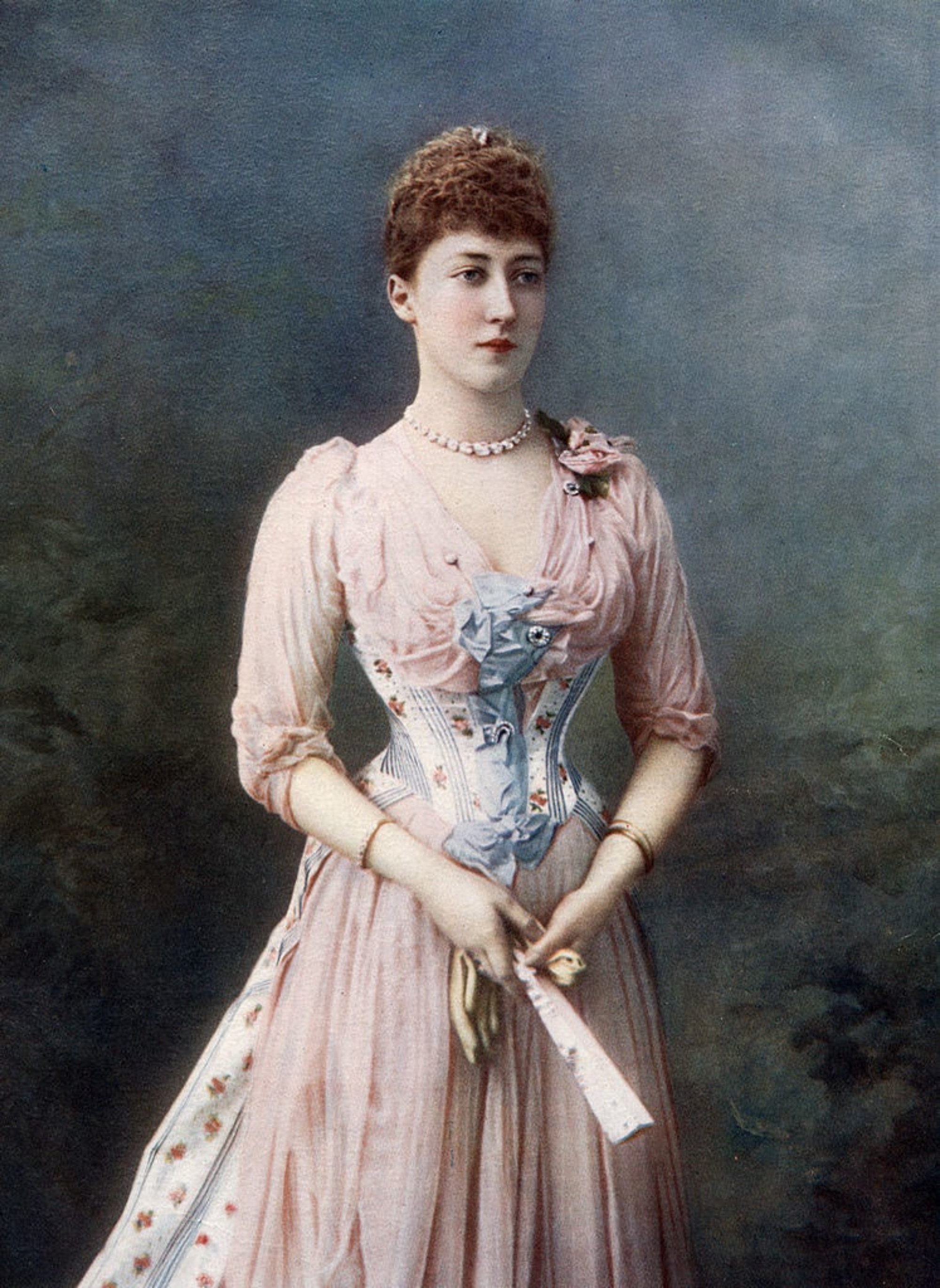 a woman in a formal dress with a corset