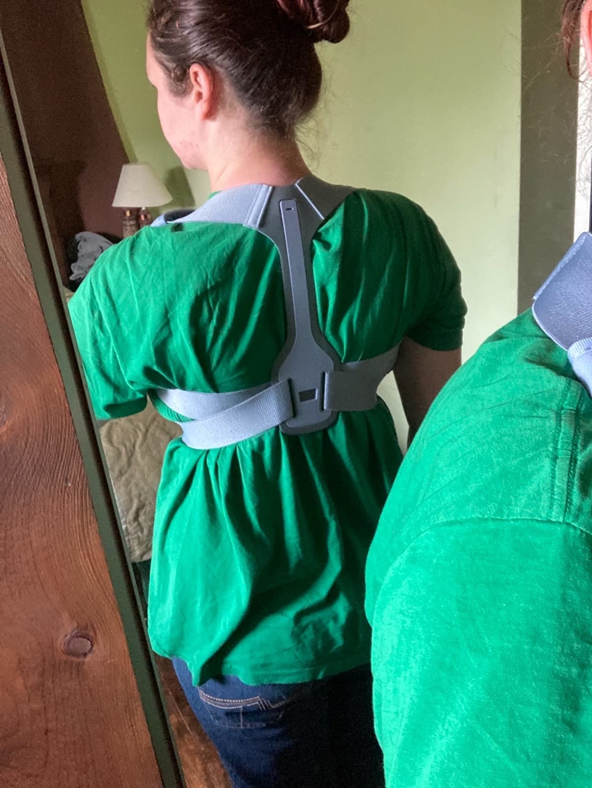 mirror selfie of reviewer wearing posture brace