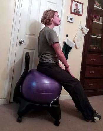 image of reviewer sitting on purple balance ball chair