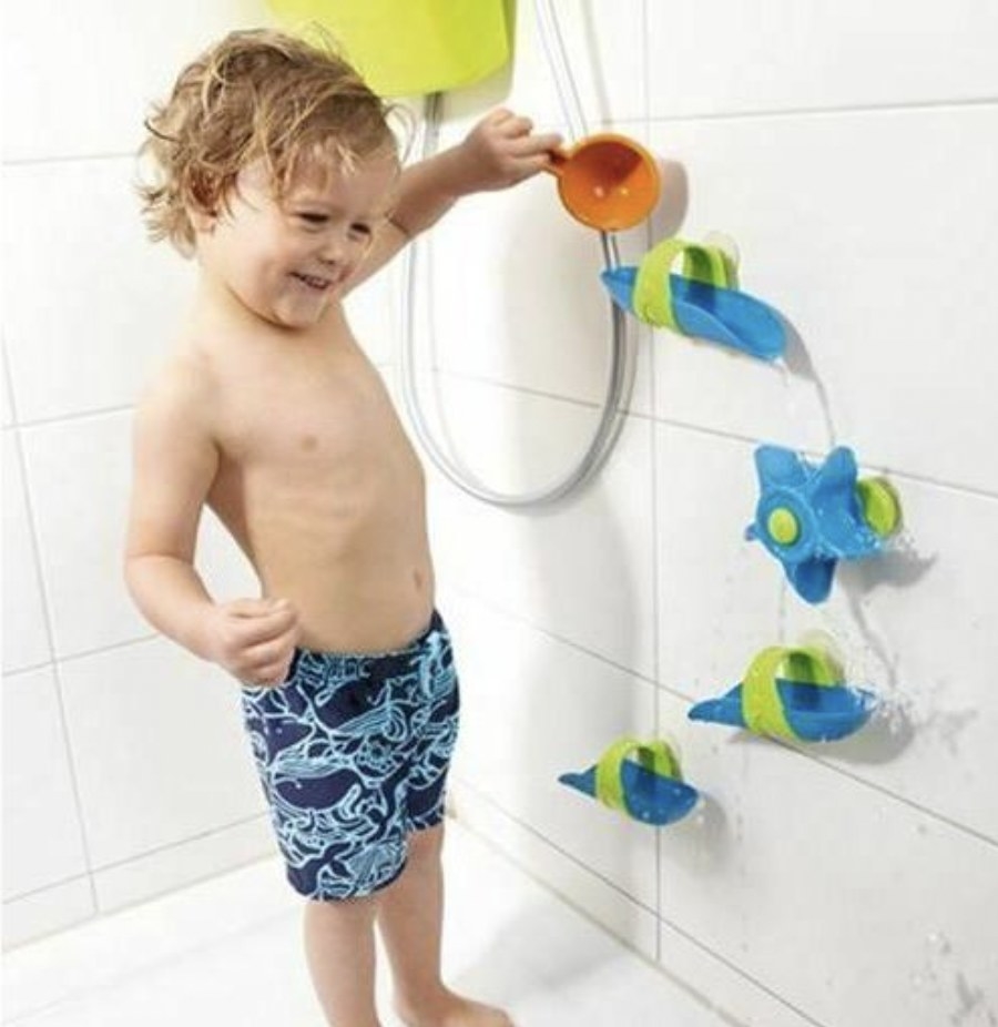 Child playing with bath ball track