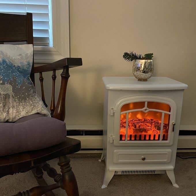 A white fake fireplace in a home