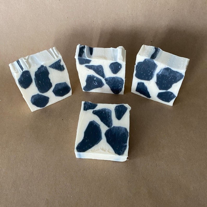 four cow print bars of soap