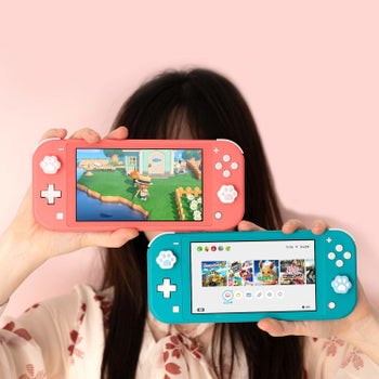 a model showing the paw prints on a pink and a blue nintendo switch lite