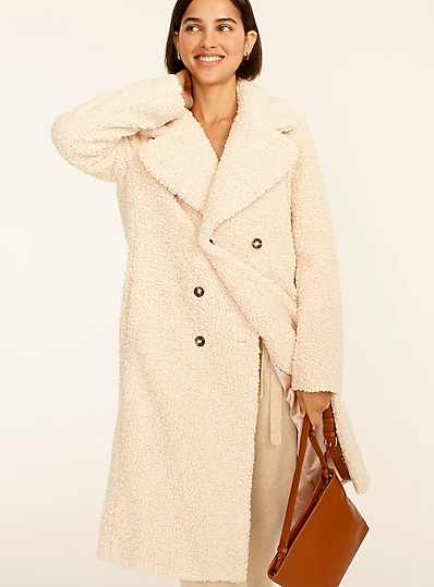 model in cream coat