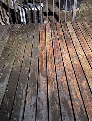 reviewer image of a deck being washed with half of it looking gray and dull, and the other half cleaned