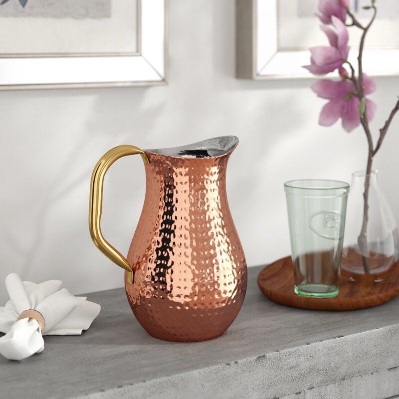 the copper pitcher with gold handle