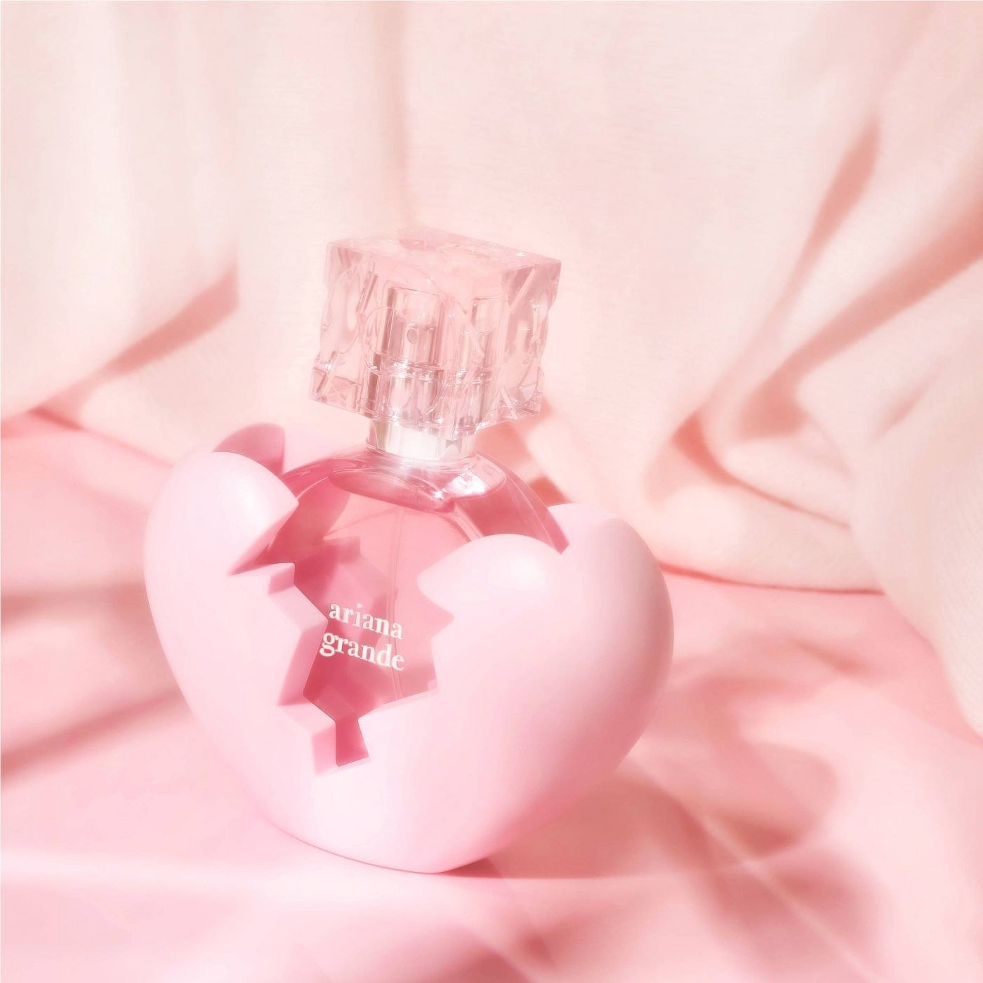 A pink bottle of perfume