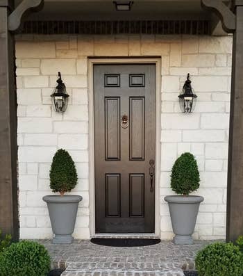 different reviewer image of front door with fresh black coat of paint