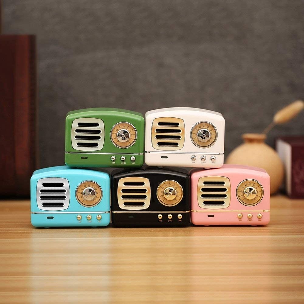 Mini retro-looking radio speakers in blue, white, black, green, and pink