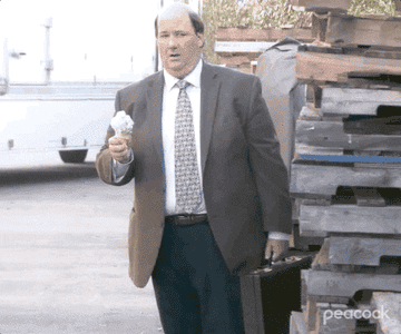 Kevin looking shocked as his ice cream falls off his cone on The Office