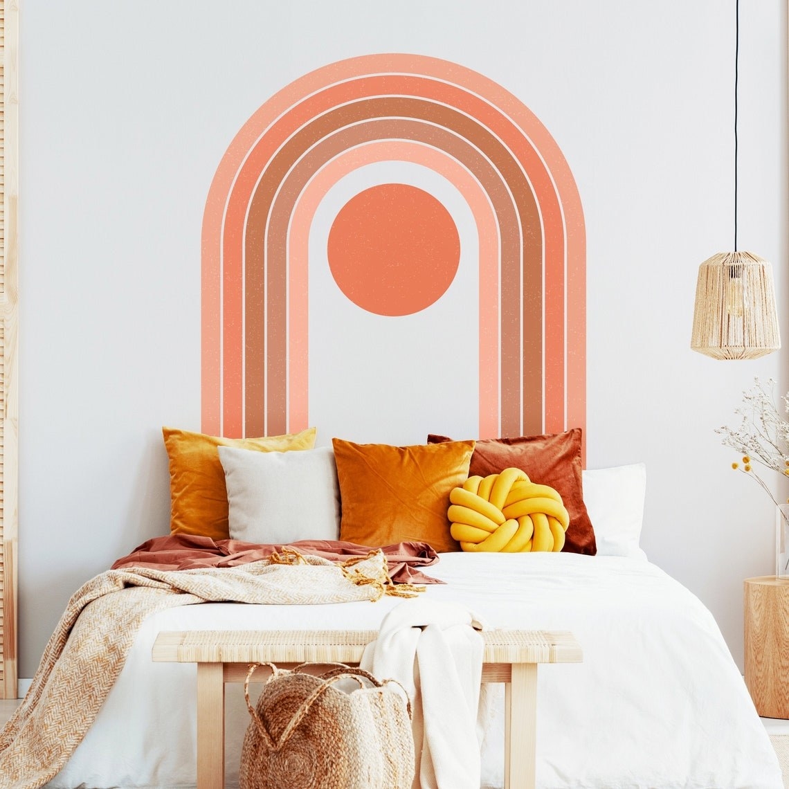 large pink rainbow wall mural above bed