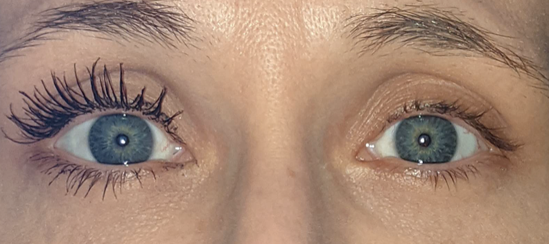 reviewer closeup with one eye with very long and thick lashes and then the other without the mascara looking bare