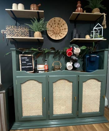 green kitchen cabinets with rattan on the doors