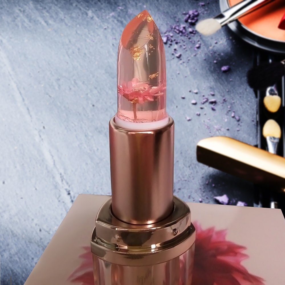 the rose gold lip balm with clear lipstick and flowers inside of it