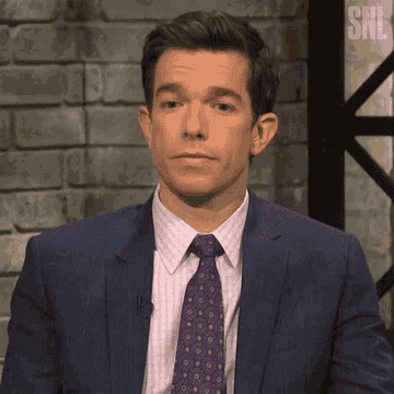 John Mulaney shrugging