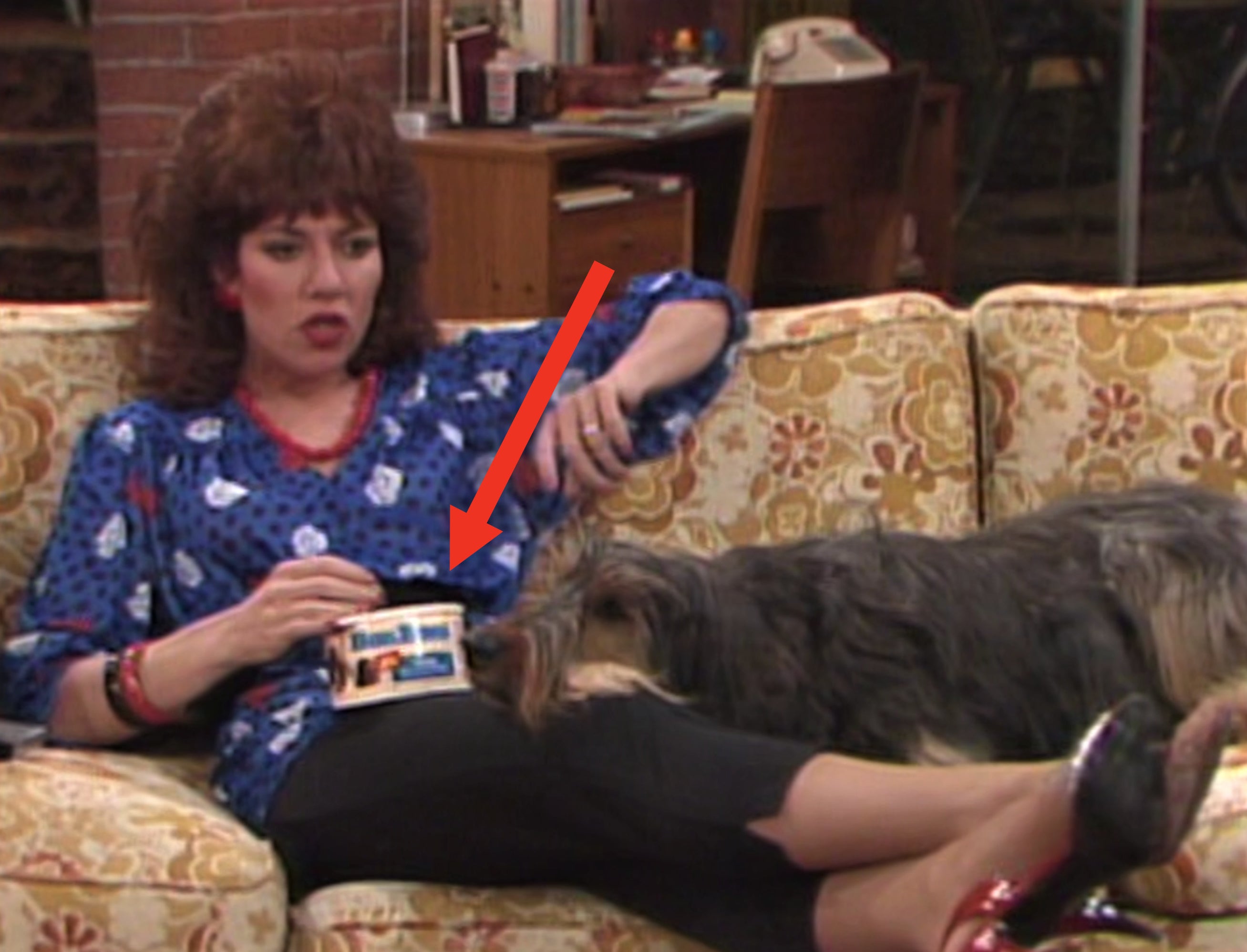 Peggy Bundy from &quot;Married With Children&quot; with feet up eating a tub of BonBons