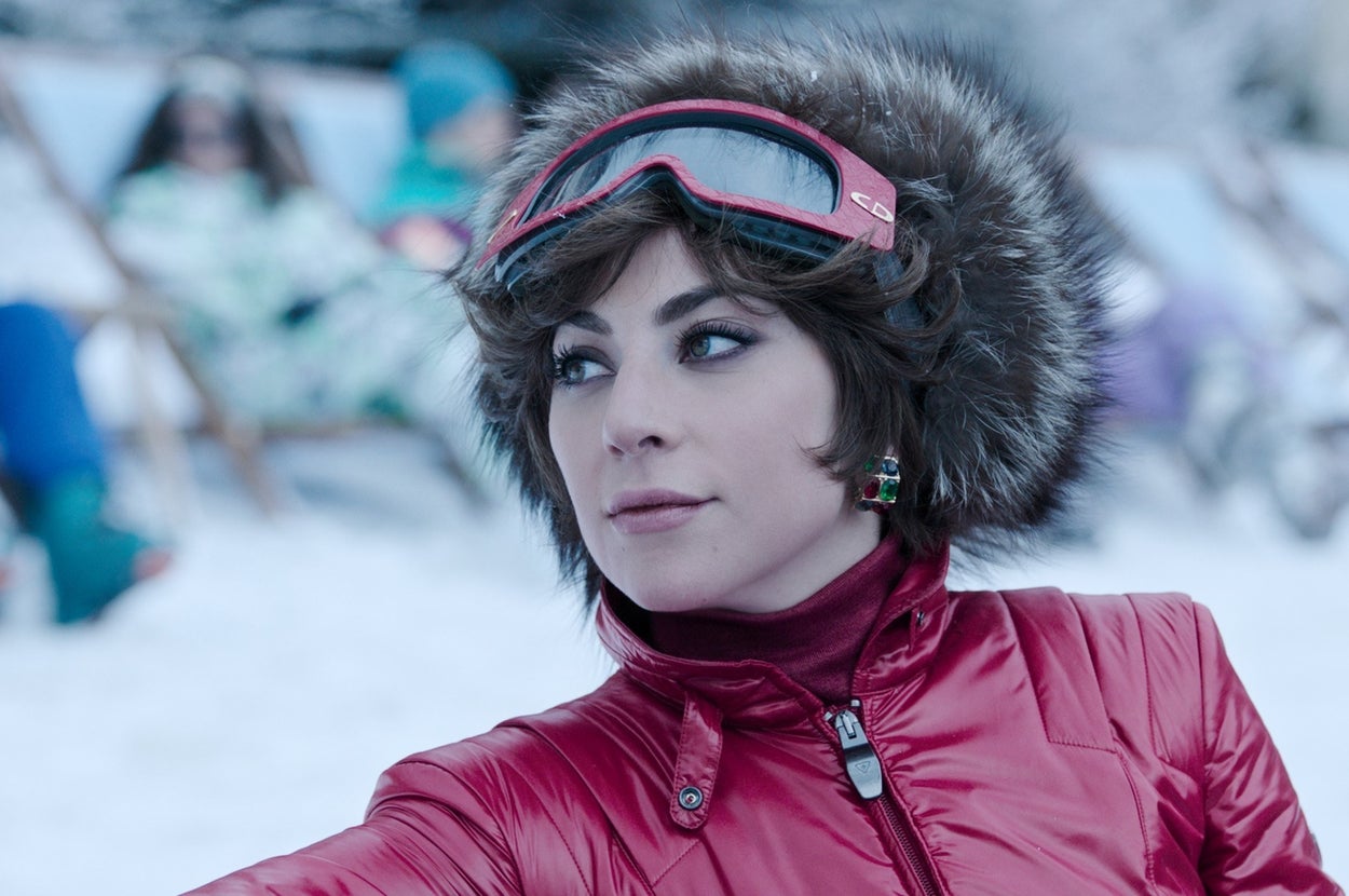 Gaga wears a fur hair and red jacket in the snow