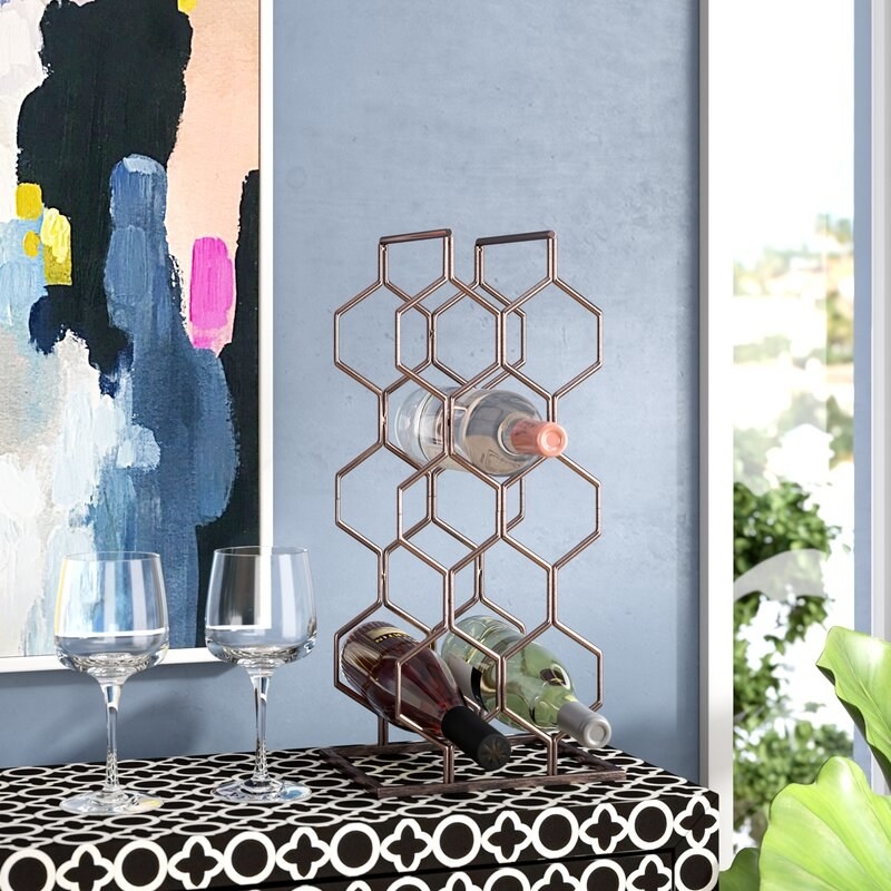 the copper wine rack in a dining room