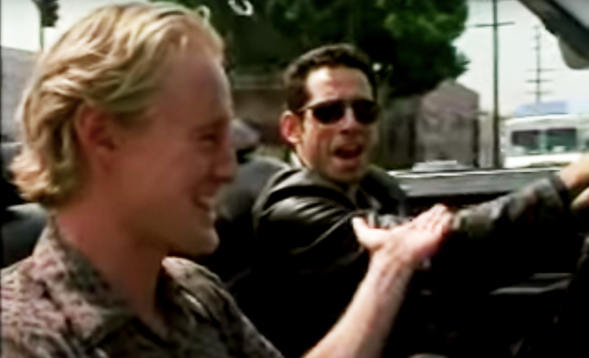 Jerry and Nicky high-five in the convertible