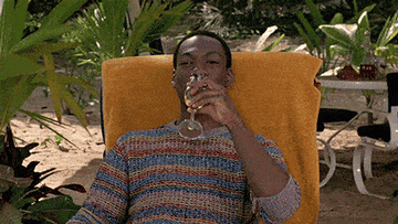 eddie murphy as billy ray madison relaxing on the beach in trading places