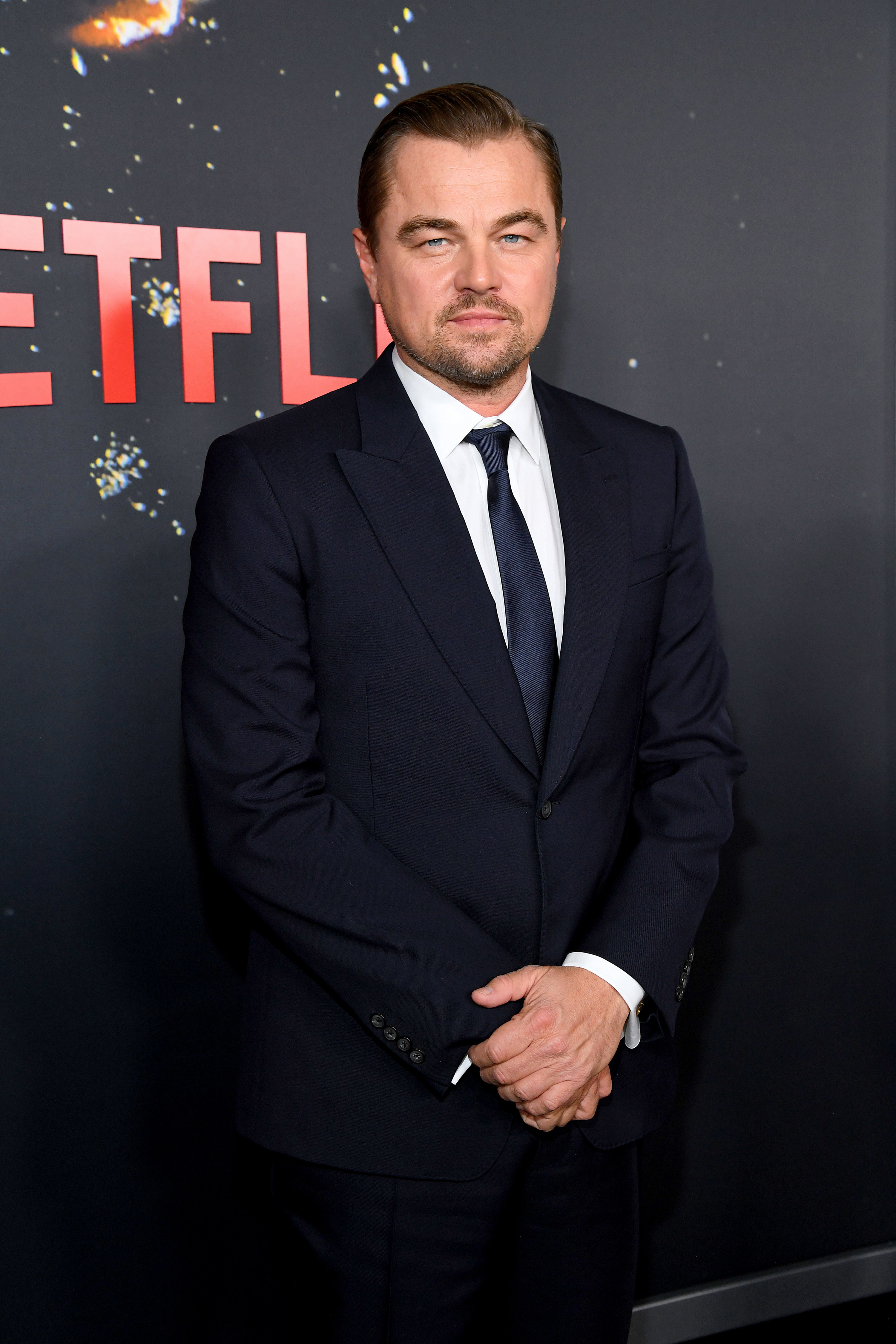Leo is in a tux at a netflix premiere