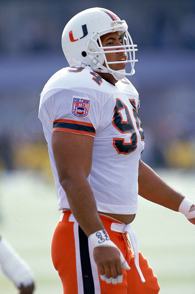 The Rock in a football uniform and helmet