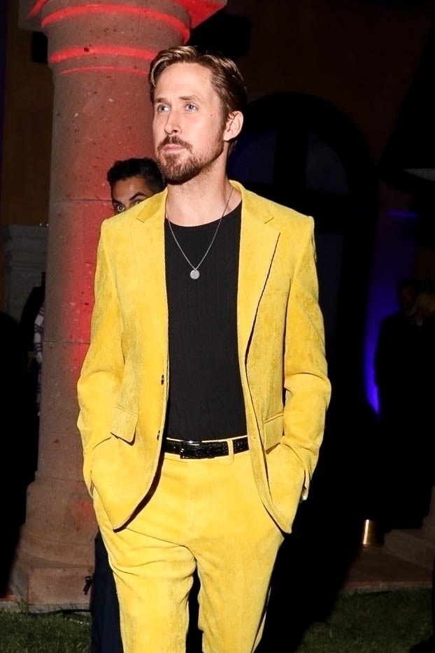 ryan is wearing a bright yellow suit