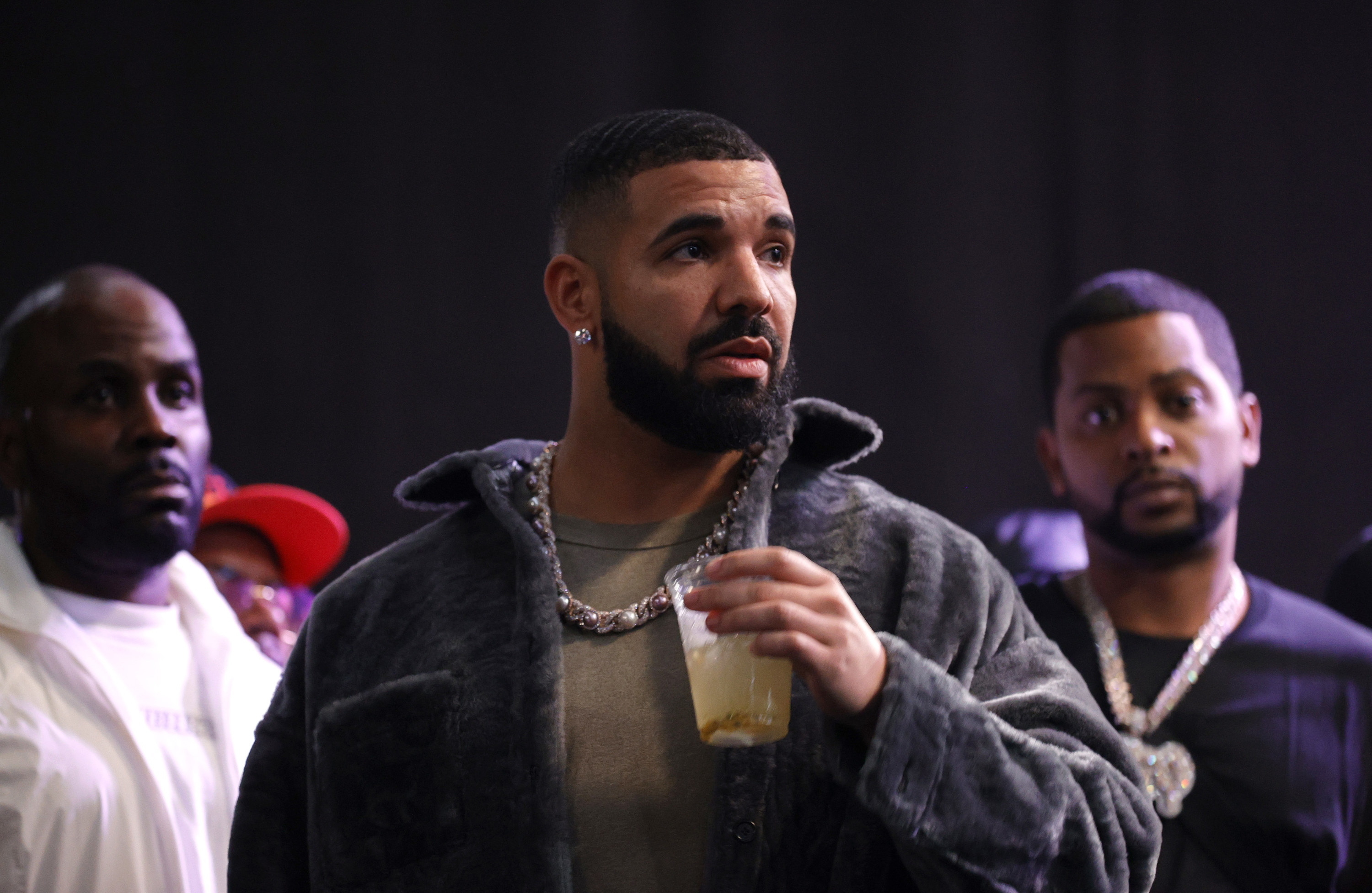 Drake is sipping on a bevvy at a rap battle