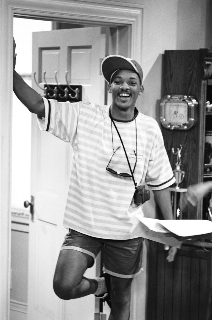 Will Smith in shorts and a cap on the set of Fresh Prince