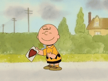 a gif of charlie brown with a valentine