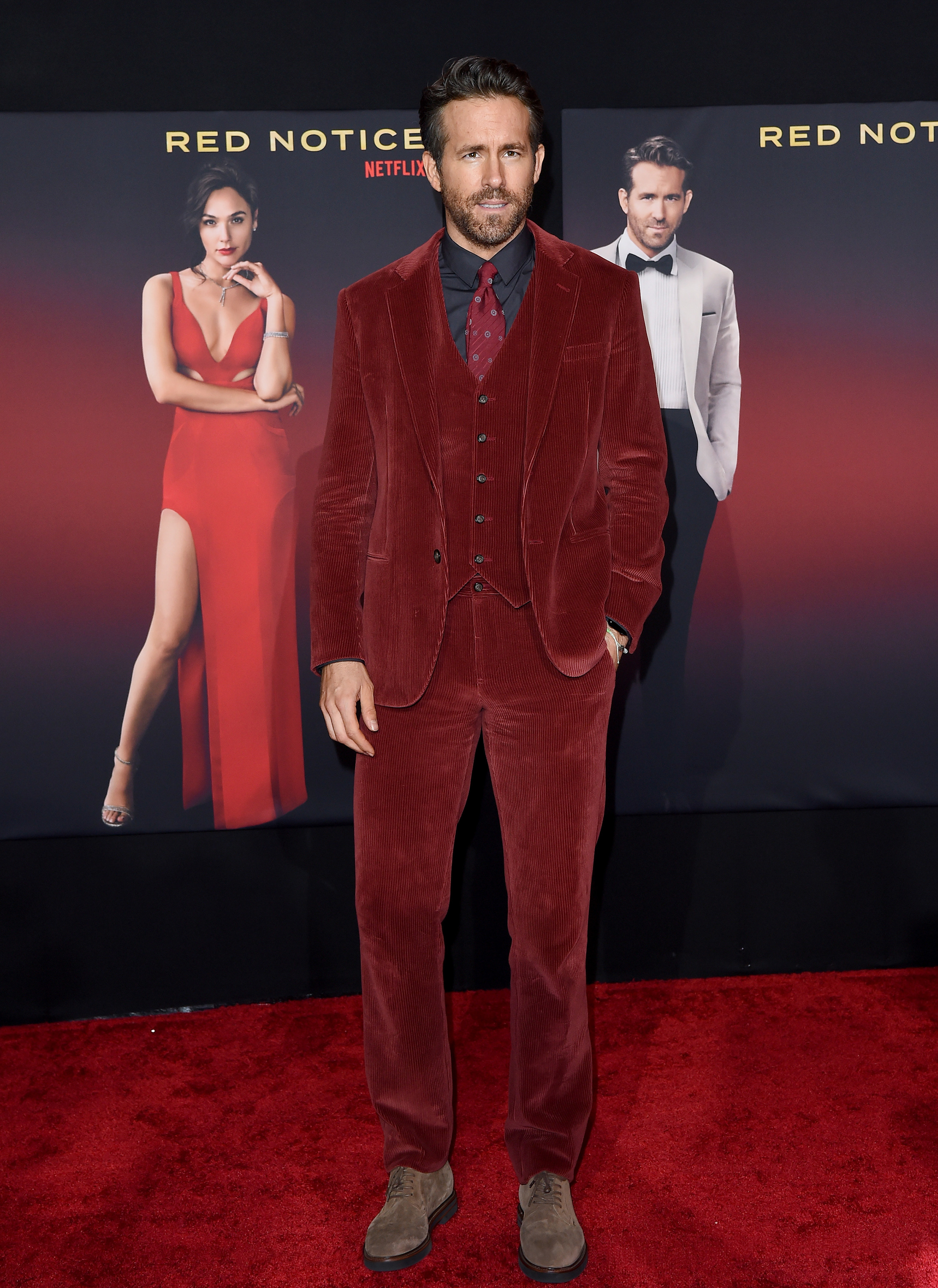 Ryan at the Red Notice premiere in a red suit