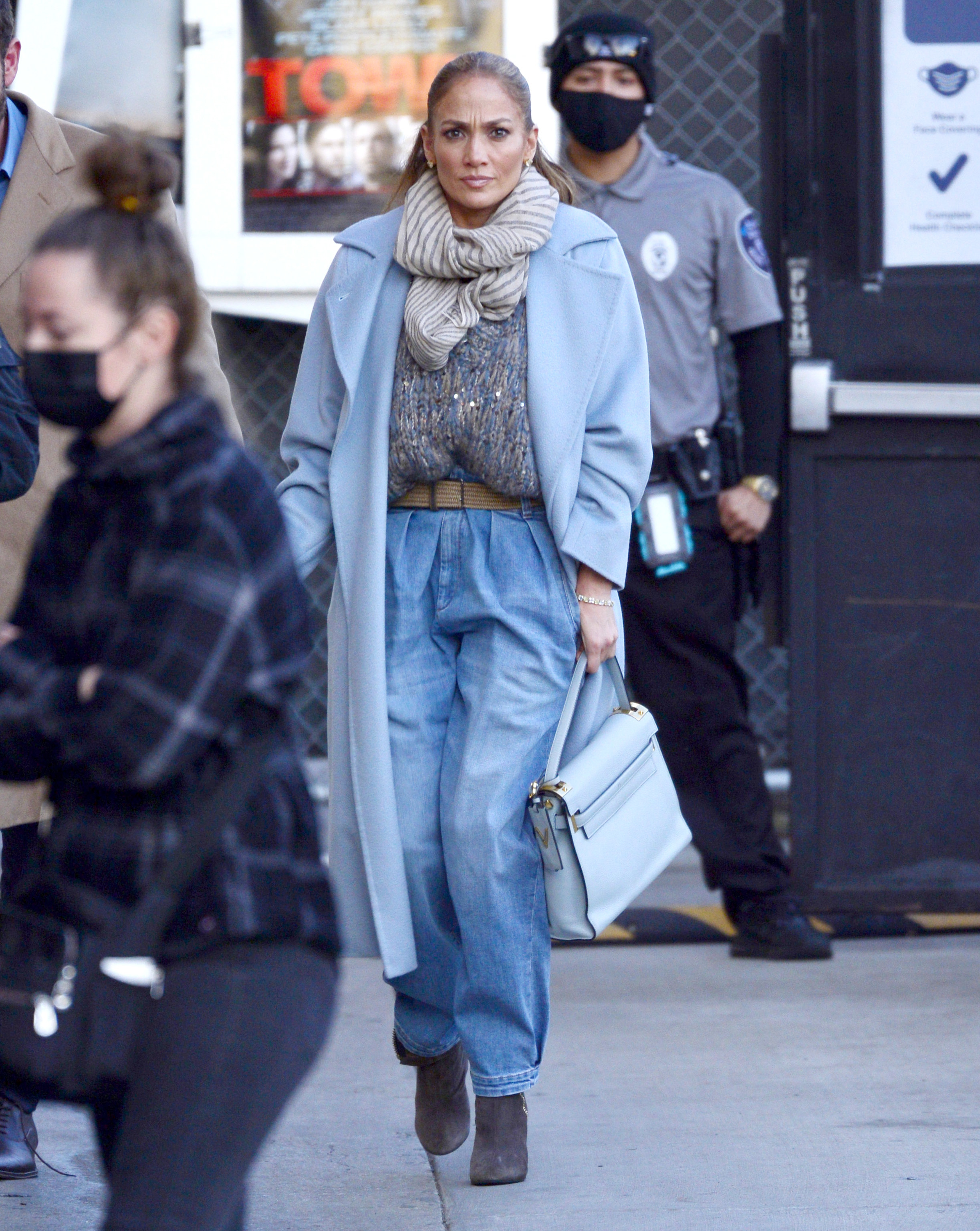 Jen is seen walking in LA in baggy jeans, long coat, loose scarf, and boots