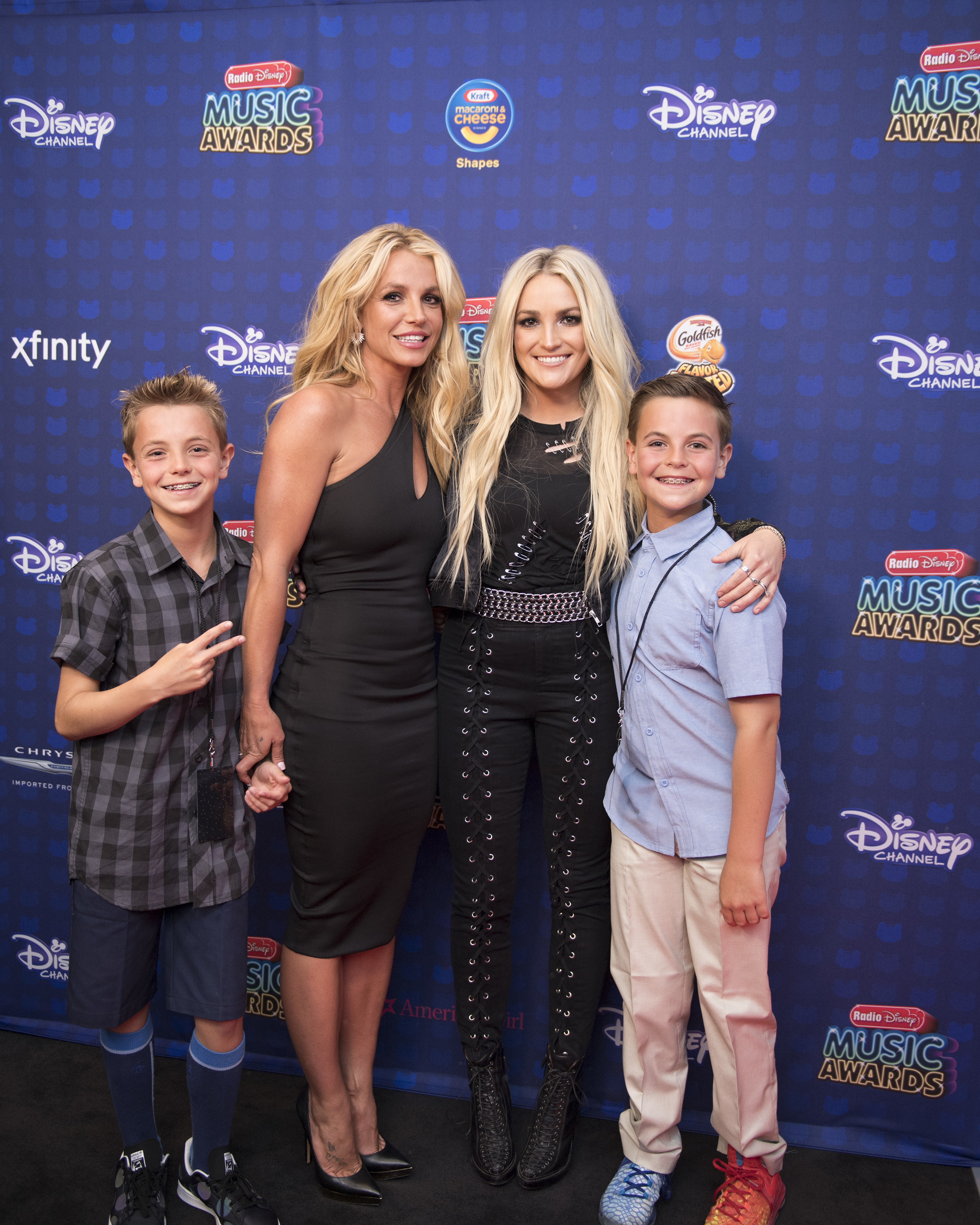 The sisters posing for pictures at the Disney Music Awards with Britney&#x27;s two sons
