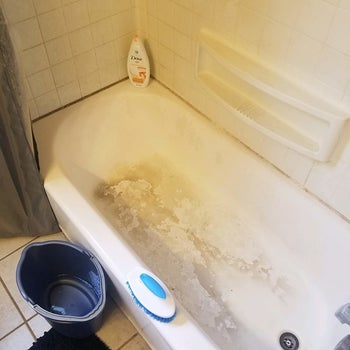 before image of a dirty and stained bathtub