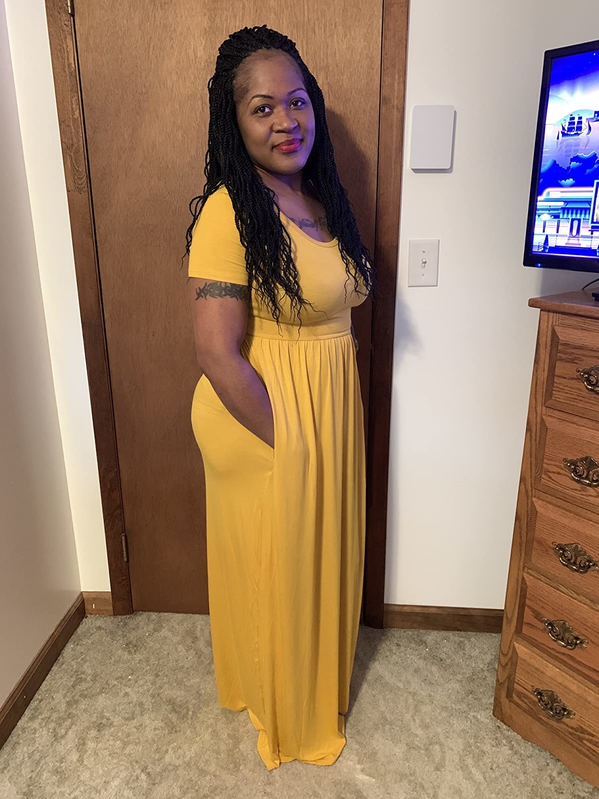 image of reviewer wearing the yellow maxi dress