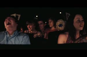 Alana driving a car with Gary, and co. while many of them laugh in "Licorice Pizza"