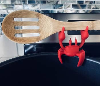 the red crab holding spoon