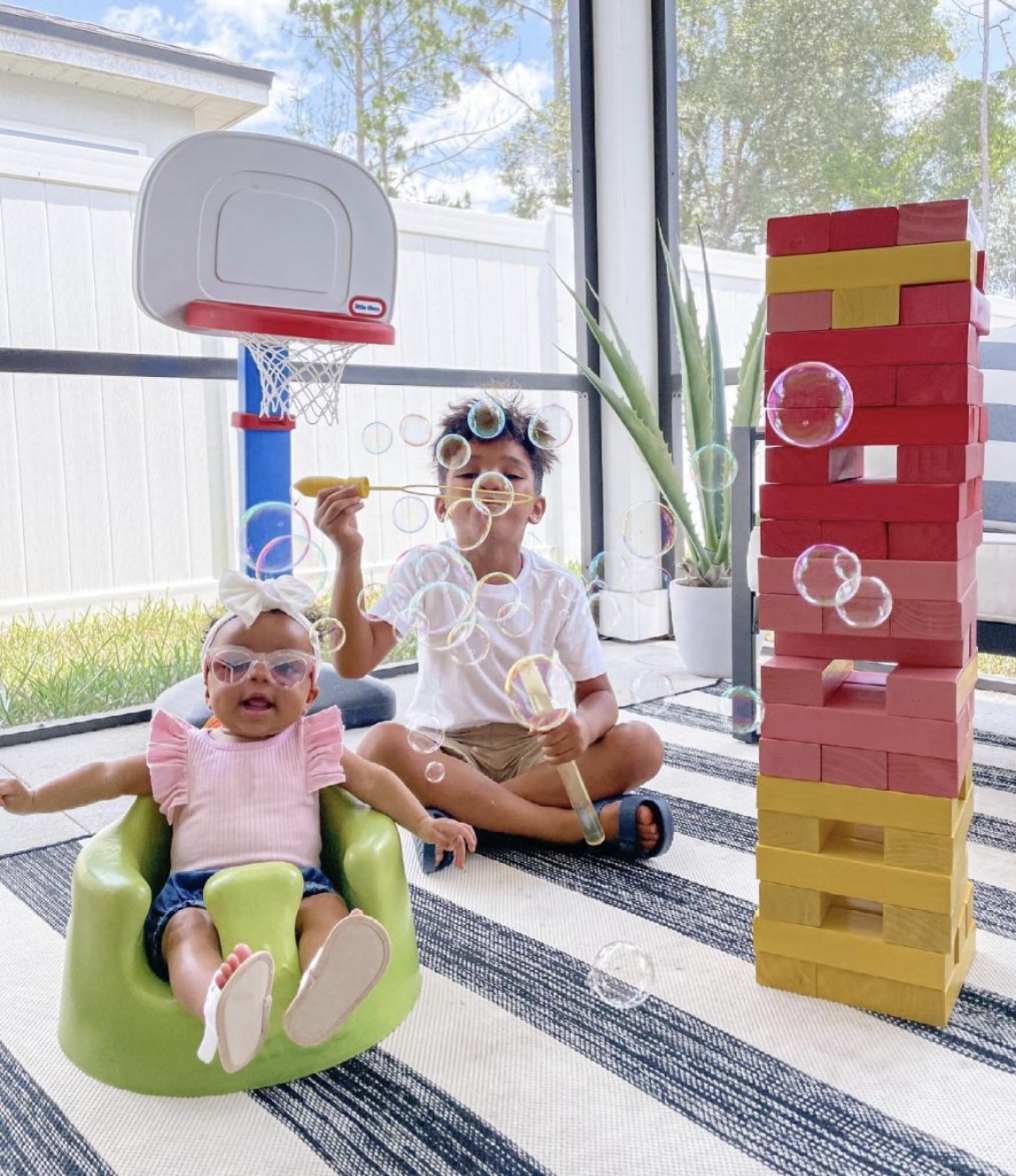 Kids playing with jumbo tipping tower