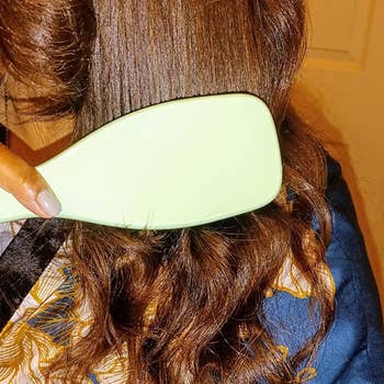 reviewer using the brush on their dry 3B/3C type hair