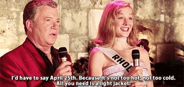 Heather Burns standing next to William Shatner saying, &quot;I&#x27;d have to say April 25th. Because it&#x27;s not too hot, not too cold. All you need is a light jacket&quot;