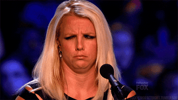 Britney Spears looking confused as a judge on the X Factor
