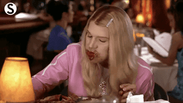 person stuffing face with food