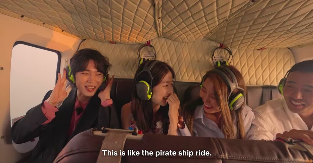 Si-hun, Ji-yeon, So-yeon and Jin-taek laugh and compare the helicopter to a pirate ship ride