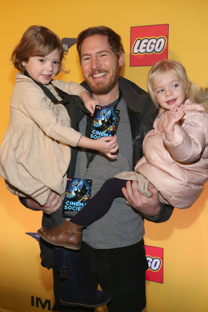 Drew&#x27;s ex-boyfriend holding their daughters at a red carpet event