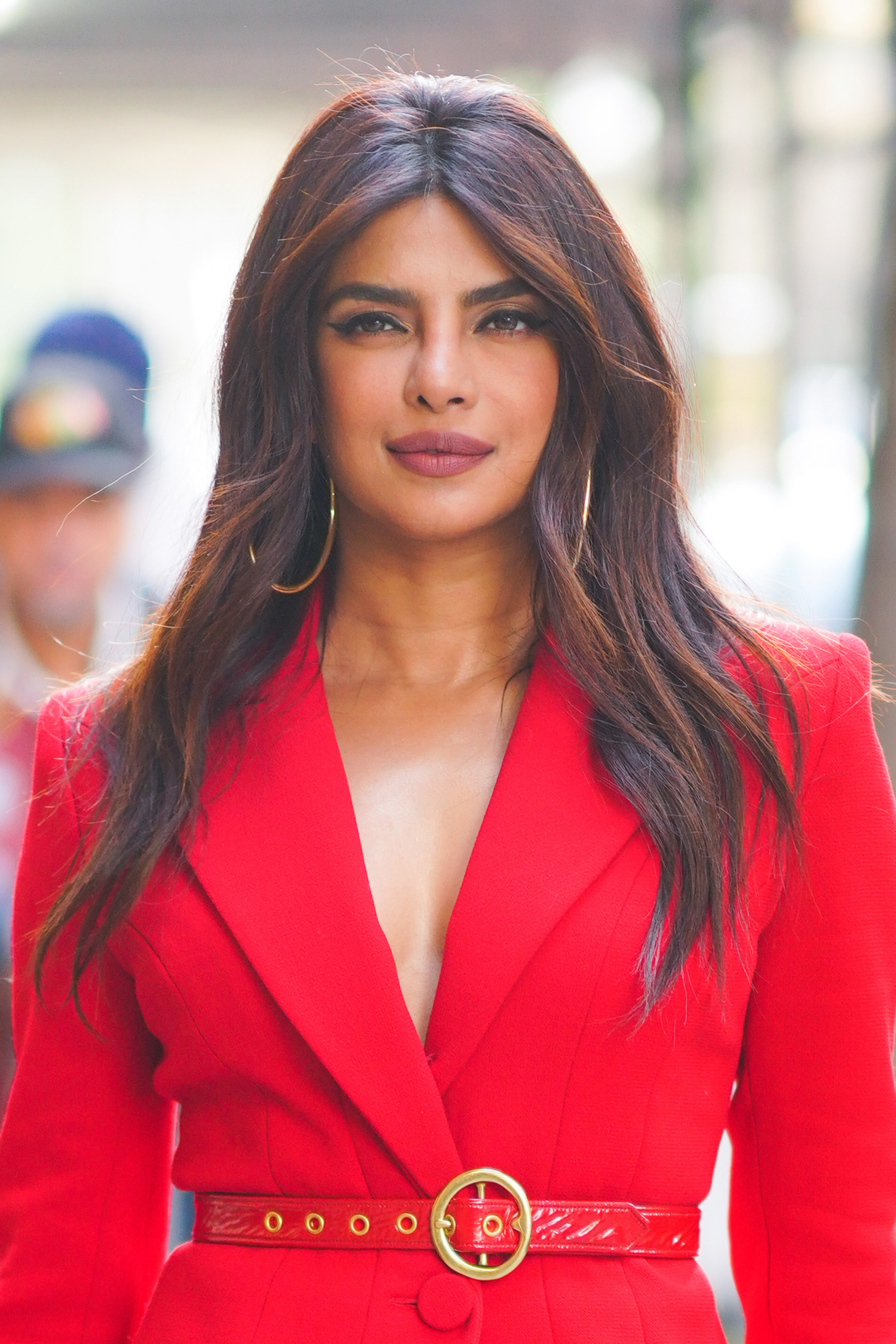 Priyanka Chopra pictured in a red pantsuit on December 16, 2021 in New York City